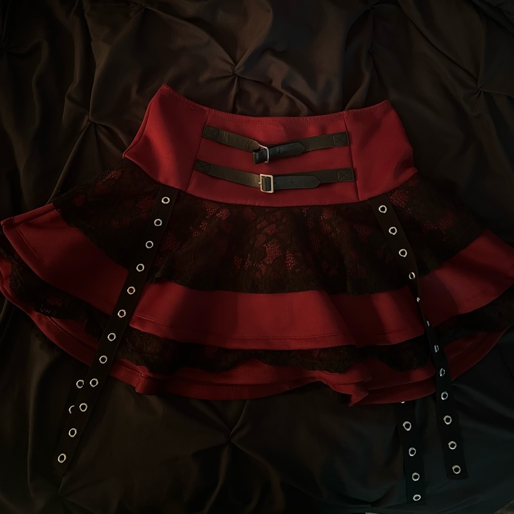 Red social collision skirt with black lace details